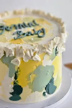Yellow and green painted buttercream cake