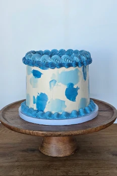 Blue vintage-style buttercream cake on stand