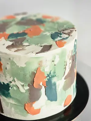 Green and orange abstract buttercream cake detail
