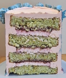 Cake cross-section showing layered cake structure with sponge layers and pink filling