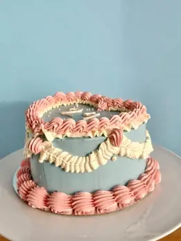 Blue and pink vintage heart cake with buttercream message