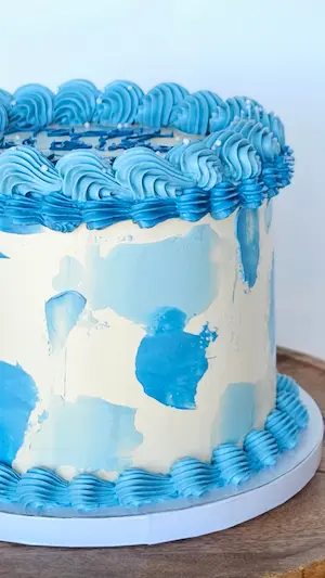 Blue piped buttercream cake detail
