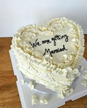 White heart cake with vintage piping