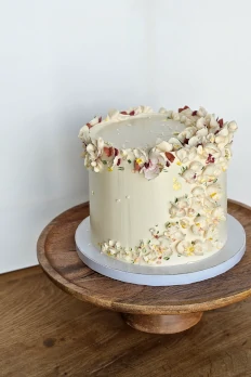 Buttercream cake with pastel petal crown